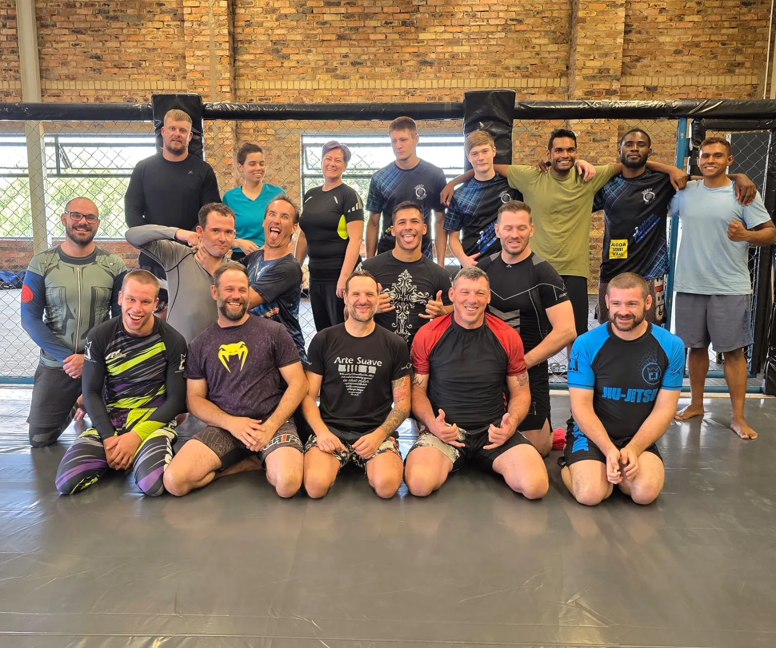 An adult class on the mats at Mighty Warriors