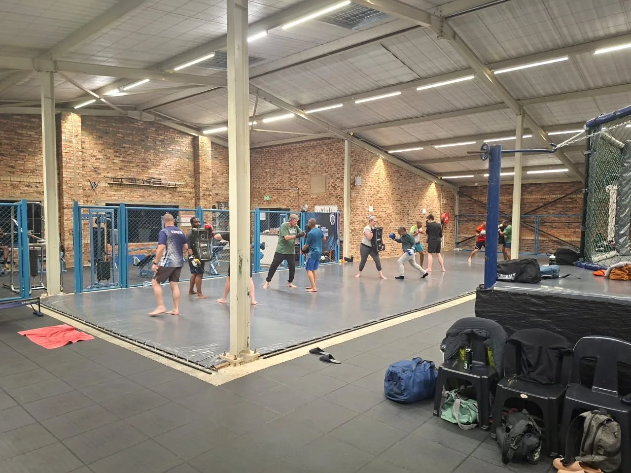 A class training beside the cage at Mighty Warriors
